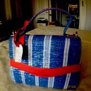 Trybal Marks is a beautiful small bag. Free with $50 purchase.